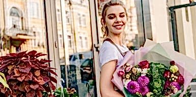 Woman purchasing roses from a florist.