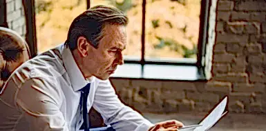 A small business owner reviews a document.