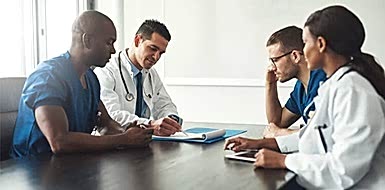 Medical team having a meeting about HIPAA security compliance.