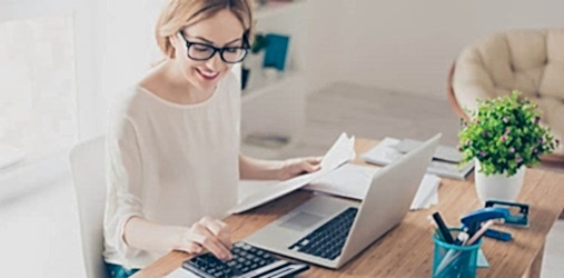 A woman using her calculator to determine consulting fees