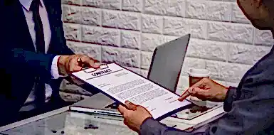 Business people reviewing contract