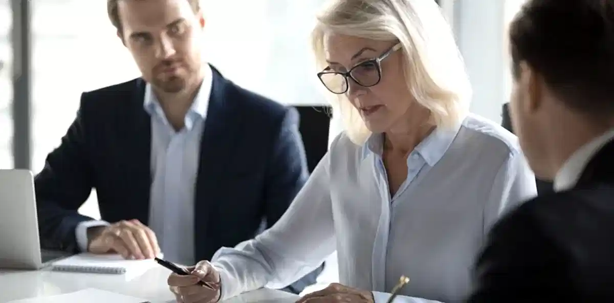 Person signing insurance and bonding documents.