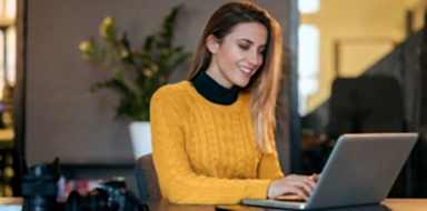 A gig worker planning on her laptop.