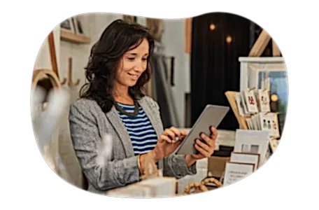 Small business owner looking for insurance quotes on their tablet. Small business owner looking for insurance quotes on their tablet.
