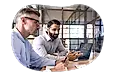 Stock brokers reviewing latest market trends.