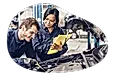 Auto mechanic repairing a car engine.