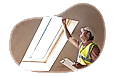 Building inspector looking at the structure of a window frame.