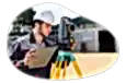 Land surveyor observing a plot of land.