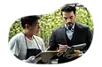 Cannabis dispensary property owner going through sales figures with employee.