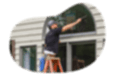 Window cleaner wiping a client's window.