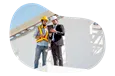 Commercial builder and client looking at blueprints.