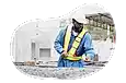 Contractor smoothing down recently poured concrete.