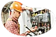 Electrician inspecting the wiring on a circuit breaker.
