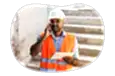 General contractor discussing worksite plans with a client.