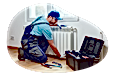 Handyman investigating the wall of a client's home.