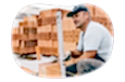 Masonry contractor setting a level at a worksite.