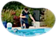 A pool and spa contractor adds chemicals to a new swimming pool.