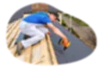Roofing contractor applying tile to the roof of a house.