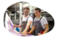 Print shop employees creating a giant photo.