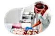 A donut shop owner assembling a new batch of donuts