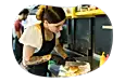 Food vendor employee preparing an order.