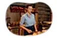 Juice bar employee slicing fruit.