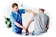 Chiropractor examining a patient's arm.