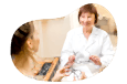 Optician testing glasses with a patient.