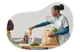 Caregiver providing food for a patient.