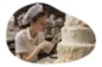 Baker decorating a cake.