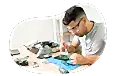 Computer repair tech fixing computer parts.