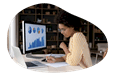 Data analyst examining trends on a computer.