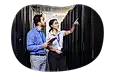 Tech experts evaluate data center equipment.