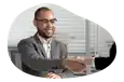 IT staffing agency employee shaking hands with a client.