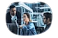 An IT trainer providing instruction to a client and their employee