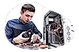 An employee at a PC building business assembles a computer.