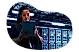 SaaS employee works on a tablet in a server room.