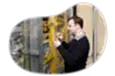 Telecommunications consultant examining wiring at a client facility.