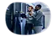 Web hosting technicians looking at web mainframe.