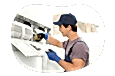 Appliance installation professional connecting appliance wiring.