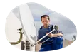 A contractor installs a new satellite dish.