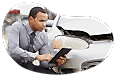 Insurance claims adjuster evaluating vehicle damage.