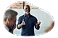 Corporate trainer giving a lecture to employees at a business.
