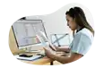 Medical billing professional reviewing invoices.