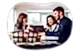Mortgage broker reviewing housing information at a table with clients.