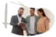 Real estate agent reviewing housing information with two clients.