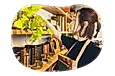 An employee arranging books in an antique shop.