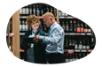 Liquor store salesman showing inventory to a client.