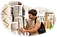A customer examines a rolled up carpet at a store.