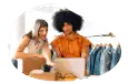 Online retailer employees fulfilling an order on a computer.